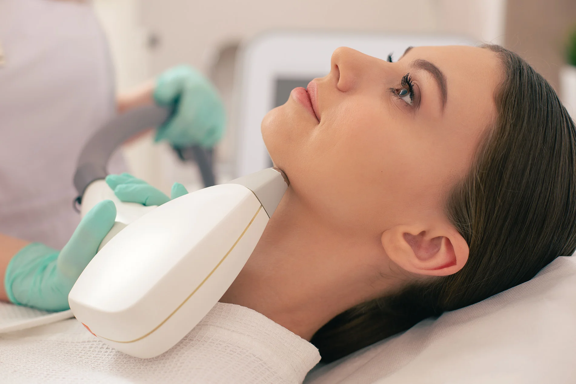 Female patient receiving double chin treatment to reduce fullness under the chin.